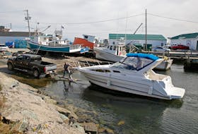 A yacht is pulled out of the water, ahead of Tuesday's forecasted post-tropical storm Teddy, in Eastern Passage Monday, Sept. 21, 2020.