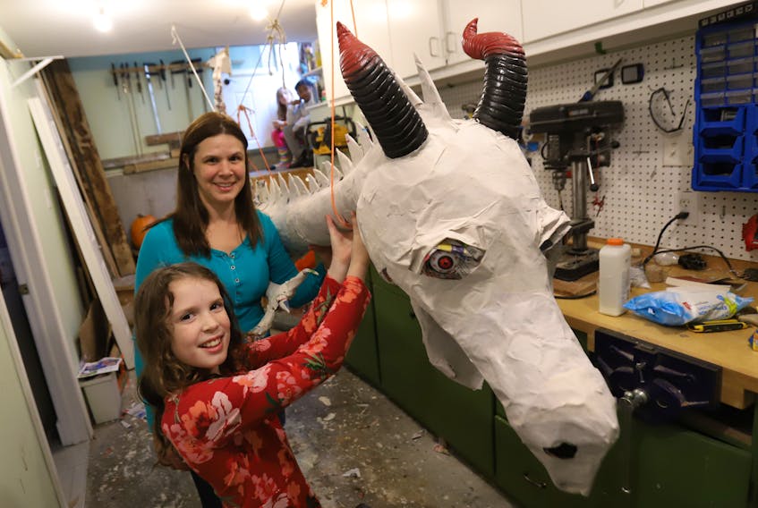 Michelle Thornhill, seen with her daughter Alice, has been constructing a four-meter dragon named Todd, in the workroom of their home in Dartmouth on Wednesday, Oct. 14, 2020. The dragon was Alice's idea that she got from a book she read. It will be placed above the family's front porch and will dispense candy on Halloween.