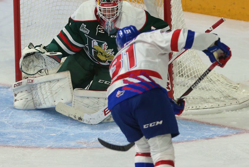Moncton Wildcats forward Alexander Khovavanov fires a shot on Halifax Mooseheads goalie Alexis Gravel during the first period of their QMJHL game Friday night in Halifax. TIM KROCHAK / The Chronicle Herald