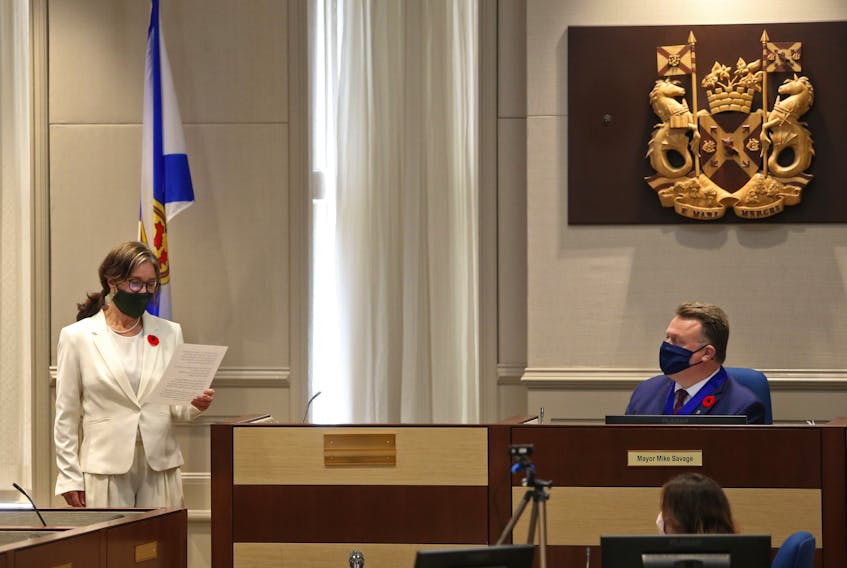 FOR NEWS STORY:
New District 11 councillor, Patty Cuttell, reads her oath of office as she is sworn in as a new member to the council, as HRM Mayor Michael Savage, looks on at City Hall in Halifax Tuesday November 10, 2020.

TIM KROCHAK PHOTO