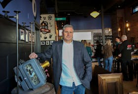 Brian Titus, co-founder and president of Garrison Brewing, shows off an old Century movie projector once used at the Oxford Theatre during a sneak peek of the brewery's new taproom, the Oxford, in Halifax on Thursday. TIM KROCHAK - The Chronicle Herald