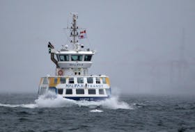 A Halifax ferry plies the choppy waters shortly after service resumed following inclement weather in Halifax Harbour on Monday November 16, 2020.