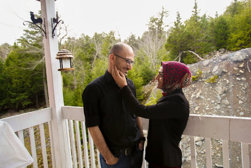FOR ZIAFATI STORY:
 Ashty Ninakaly strokes the face of her husband, Didar Ninakaly, on the deck of their Halifax home Thursday December 3, 2020. Didar applied for a citizenship test in August 2019 but has been waiting since then to hear back from the federal government. He says the virtual citizenship tests are a "great and ideal solution" during the pandemic, he just wishes the system moved quicker to receive his citizenship. SEE STORY FOR MORE DETAILS

TIM KROCHAK PHOTO