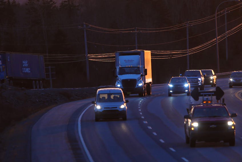 Transport trucks are seen on highway 102 outside Halifax Wednesday December 23, 2020. When the pandemic hit, truckers kept food and essential goods moving in and out of Nova Scotia.