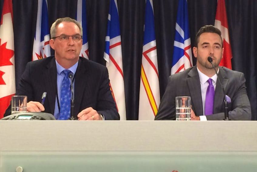 SiRT director Ronald MacDonald and Justice Minister Andrew Parsons speak to the media Thursday afternoon.