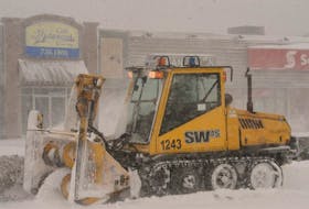A City of St. John’s snowclearing team employee makes his way down east-end Elizabeth Avenue as he clears the sidewalks during the blizzard on Tuesday afternoon.