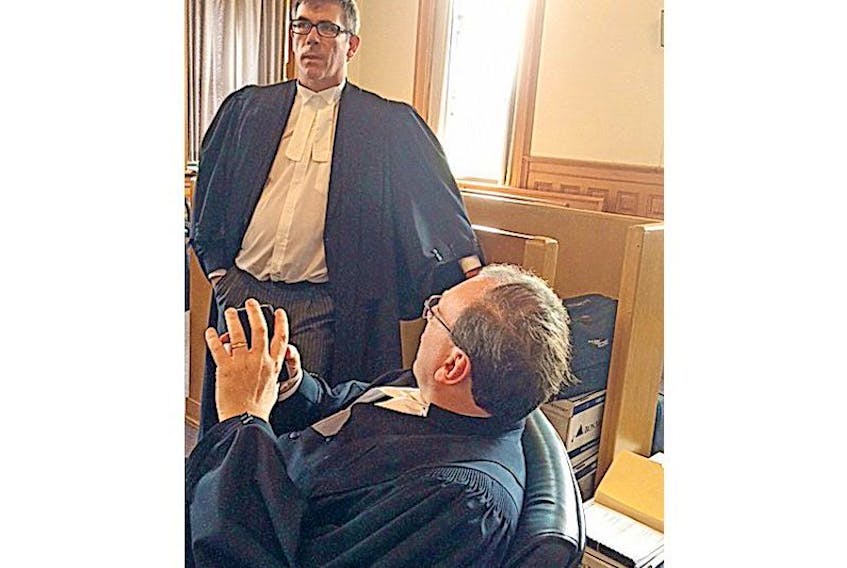 Mount Cashel abuse claimants’ lawyer Geoff Budden (left) speaks with Toronto lawyer Mark Frederick, who represents the Roman Catholic Episcopal Corp. of St. John’s. They were at the first day of the start of the Mount Cashel civil trial in the Supreme Court of Newfoundland and Labrador.