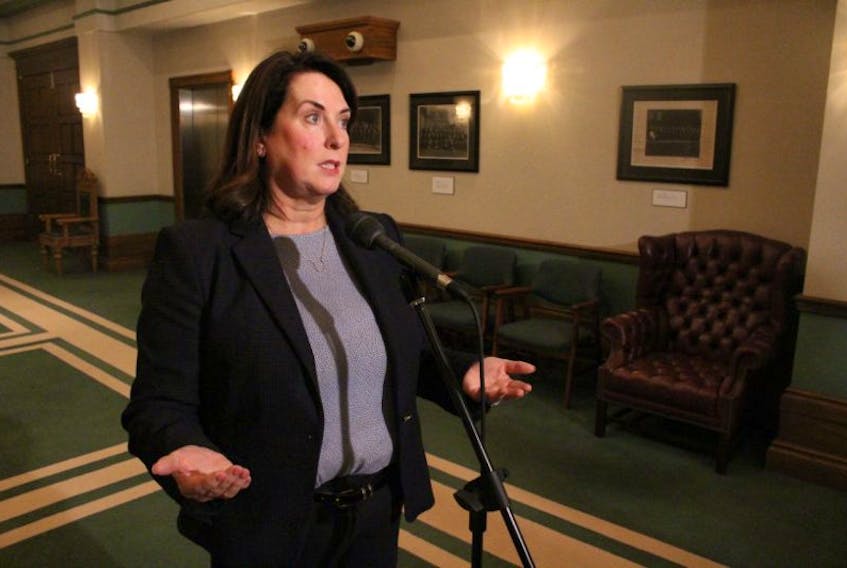 Natural Resources Minister Siobhan Coady speaks to reporters outside the House of Assembly Tuesday afternoon.
