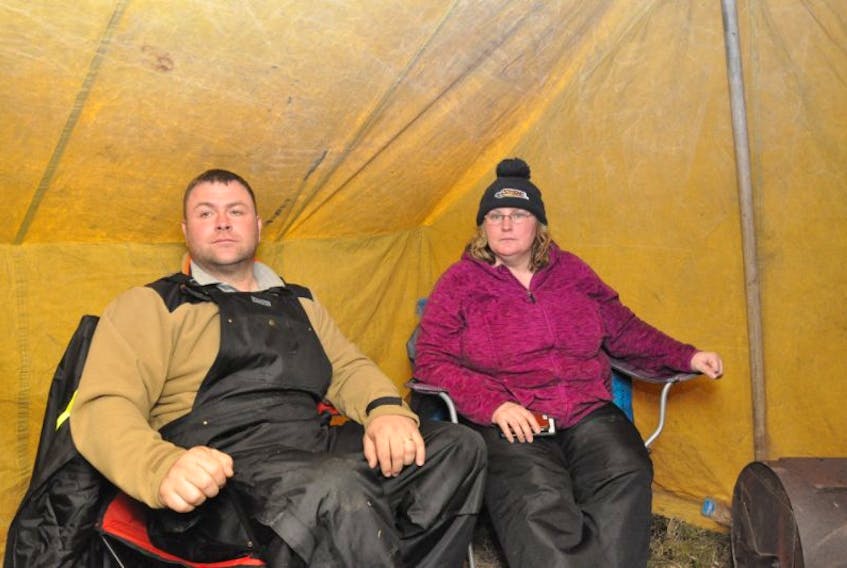 Richard Gillett and his wife, Joyce, stay warm next to a woodstove inside a Labrador tent that a supporter donated to his cause. The Twillingate fisherman and FISH-NL vice-president has been staging a hunger strike outside the DFO headquarters on White Hills in St. John’s.