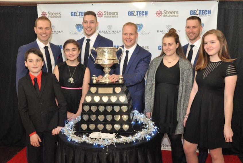 Team Gushue with junior curlers Wednesday at the Bally Haly Golf and Curling Club in St. John’s