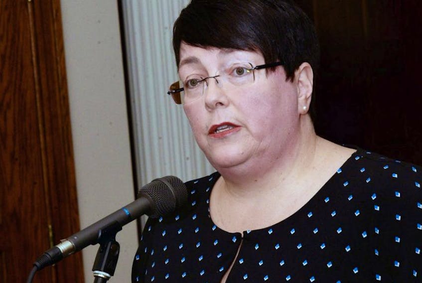 Finance Minister Cathy Bennett speaks Thursday during a news conference outside the House of Assembly, where she provided an update on the collective bargaining negotiations with NAPE.