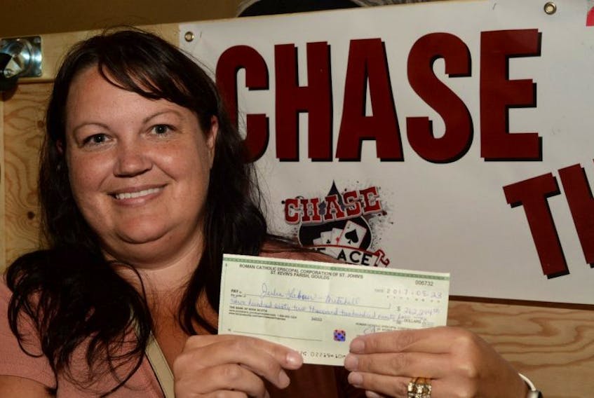 In her first time taking part in the Chase the Ace draw, Julie Labour-Mitchell of Grand La Pierre on the Burin Peninsula, picked up a consolation prize of $262,294.00 at St. Kevin’s parish Hall in the Goulds on Wednesday night. She purchased her tickets around suppertime and chose the King of Clubs after her lucky number of 3895109 was chosen from the pile of tickets.
