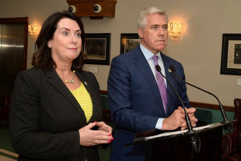 Natural Resources Minister Siobhan Coady and Premier Dwight Ball speak to the media outside the House of Assembly on Tuesday afternoon about recent public comments made by former Nalcor Energy CEO Ed Martin pertaining to the Muskrat Falls hydroelectric project.