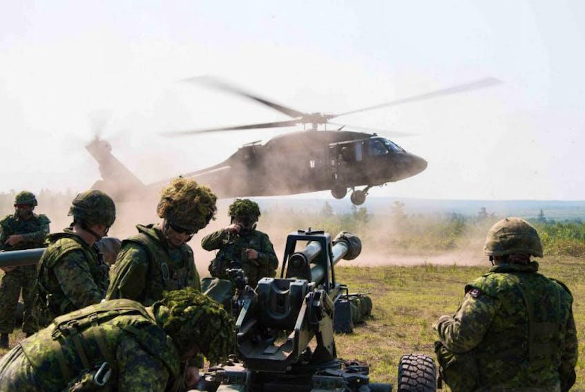 Canadian soldiers set up an artillery gun dropped into position by a U.S. National Guard UH-60 Black Hawk during training Exercise Strident Tracer 2017.