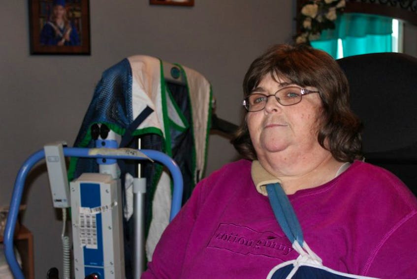 Terrie Hefford is confined to a wheelchair and requires a mechanical lift and the help of home care to get in and out of bed.