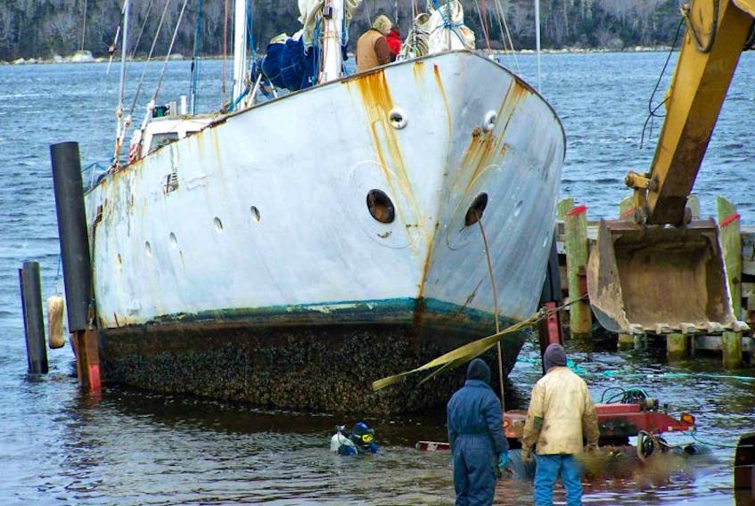 This 79-foot derelict boat was removed from the side of the Shelburne wharf in Nova Scotia in March 2014. As of 2014, the federal government counted roughly 400 possibly abandoned and derelict boats in Canada, including nearly 150 in Newfoundland.