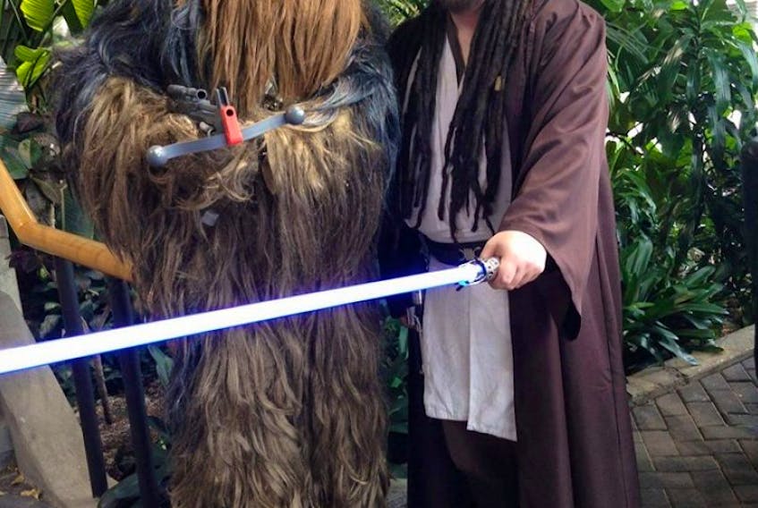 Star Wars fans Mark Walsh (left), dressed as Chewbacca, and Daryl Mekish, as a Jedi Knight, are pictured here at the 10th annual Sci-Fi On The Rock in 2015. Mekish is one of countless fanboys around the world who will be celebrating Thursday as May the Fourth, the unofficial holiday for Star Wars fans.