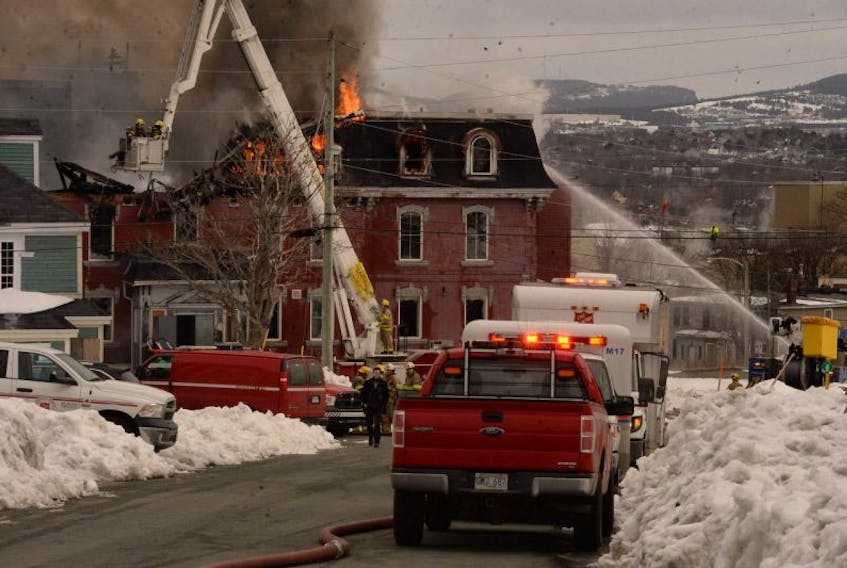 Firefighters battle a blaze Friday at the former Belvedere orphanage building in St. John’s.