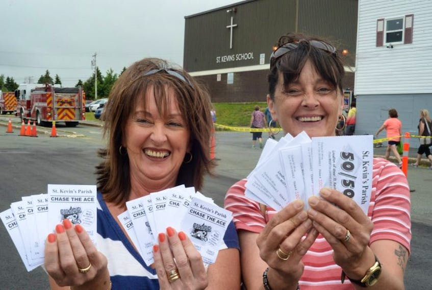 Crowds were headed out in droves to St. Kevin’s Parish in the Goulds July 12 for the Chase the Ace fundraiser.  Among those with tickets were sisters Cindy Kavanagh (left) of Cape Broyle and Roxanne O’Brien of Witless Bay. The payout is expected to top the $1-million mark this Wednesday. 