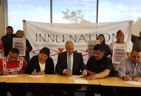 Members of the Labrador Innu Nation sign a memorandum of understanding with Premier Dwight Ball to establish an inquiry dealing with children who are taken from their community and placed in provincial government custody.