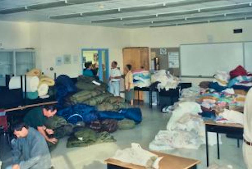 ['American Kevin Tuerff, one of almost 7,000 airline passengers stranded in Gander during the events of Sept. 11, 2001, was amazed at the kindness of local residents, who donated whatever they could to help. Pictured is a room in the Gander campus of College of the North Atlantic, filled with donated sleeping bags, blankets, pillows and other items for the passengers.']