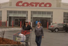 Lisa Samson (left) and her mom, Judi Samson, leave Costco  with their purchases Tuesday morning.