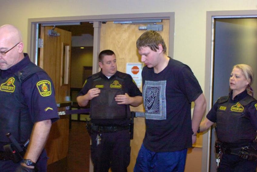 Brandon Coady, accused of attempting to murder a man early Friday morning on Weymouth Street, is led into provincial court in St. John’s Friday afternoon.