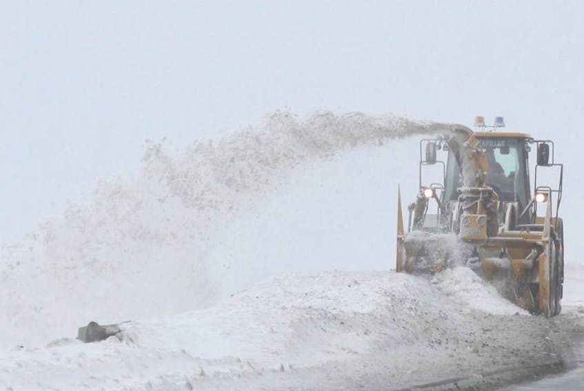 A St. John's snowclearing crew clears the sidewalks along Columbus Drive in this file photo.