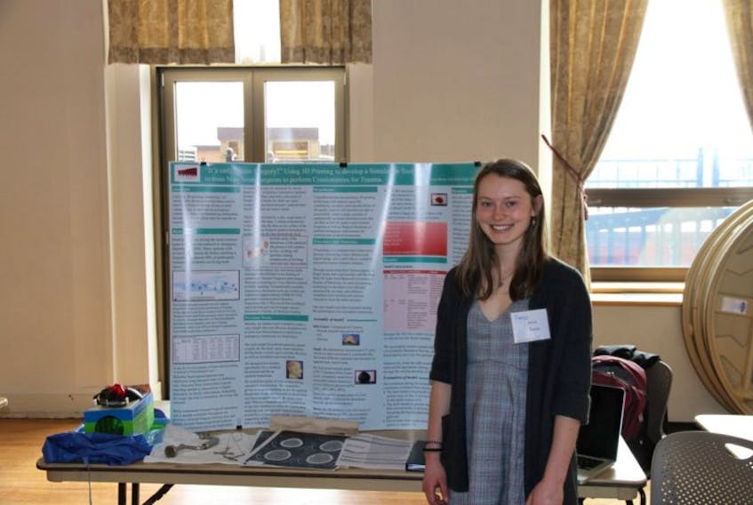 Nora Boone displays her project on using 3D printing to develop a simulation tool to help train general surgeons to do a craniotomy. Boone is a student at Holy Heart of Mary High School in St. John’s. 