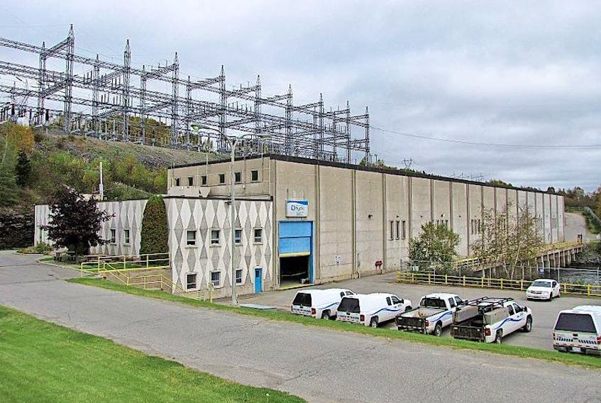 The main powerhouse at the Bay d’Espoir hydroelectric generating station. This powerhouse contains the Bay d’Espoir control centre and six of its seven generating units. A station switchyard is visible behind. A second powerhouse, housing the station’s seventh generator, was built after the first and is not visible in the photo. — Photo by Ashley Fitzpatrick/The Telegram