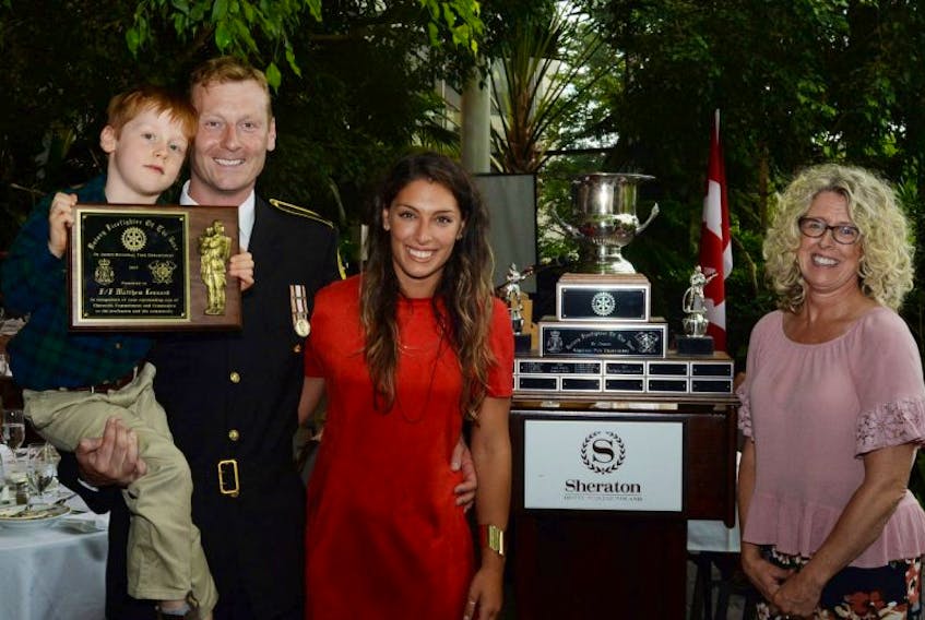 St. John’s Regional Fire Department firefighter Matthew Leonard with his son Roland, his partner Dimitra Kufudi and his mom Sheena Leonard following the presentation of the 2017 Rotary Club of St. John’s Firefighter of the Year Award.