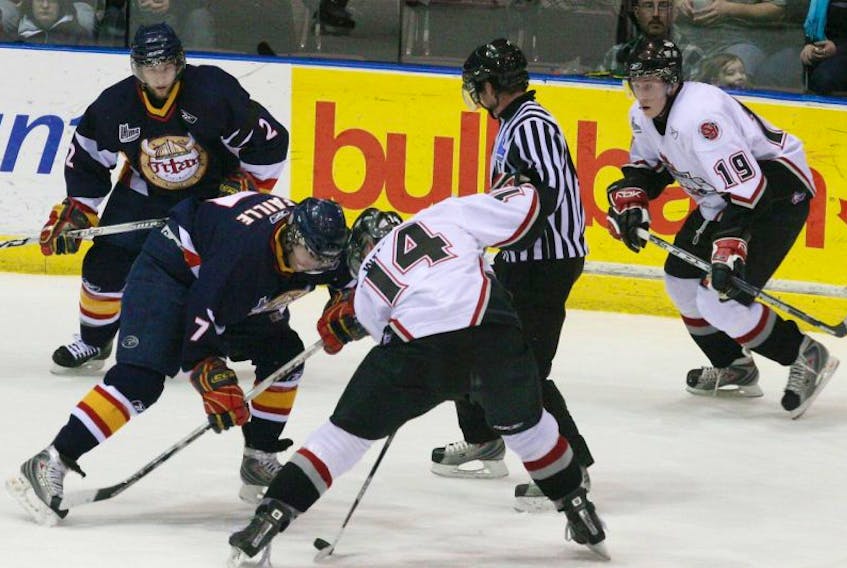 In this March 25, 2008 file photo, St. John’s Fog Devils centre Wes Welcher (14) takes a faceoff against Eric Faille of the Acadie-Bathurst Titan during QMJHL playoff action at Mile One Centre. The Fog Devils’ Luke Adam (19) and Titan’s Maxime Renaud (2) look on. That was the final season of the Fog Devils in St. John's. The franchise was sold and moved to suburban Montreal. However, the ownership group for the NBL Canada's St. John's Edge says they have already begun work at bringing the QMJHL back to Newfoundland.