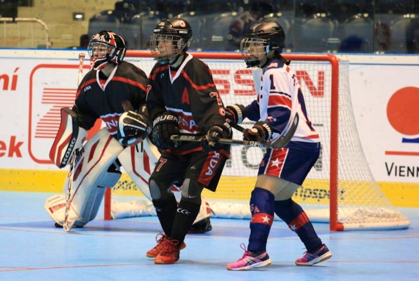 Canada’s Kristen Cooze (7) keeps an eye on the United States’ Tiffany Pfundt in front of Canadian goalie Nathalie Girouard during action in their round-robin game Monday at the world ball hockey championships in Pardubice, Czech Republic on Monday. Cooze, who had two assists in Canada’s 2-1 win, is one of five players from Newfoundland and Labrador on the Canadian roster.