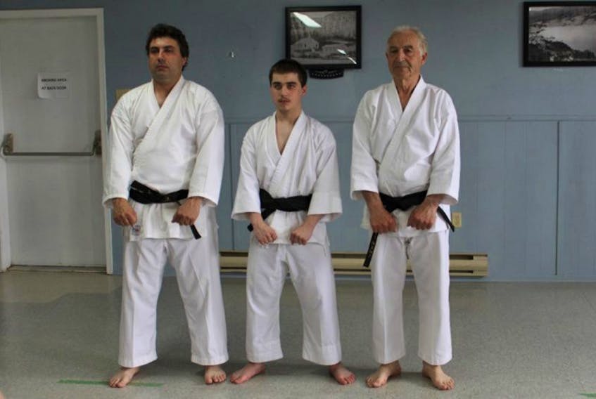 From the left, Shawn, Ryan and George, three generations of Hillyards in St. Jones Within, recently celebrated a shared achievement. They each earned their black belts in karate.