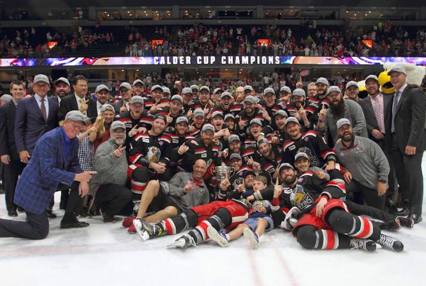 The Grand Rapids Griffins, including Newfoundland’s Daniel Cleary (second row, third from the left) celebrate around the Calder Cup after beating the Syracuse Crunch to take the AHL championship Tuesday night in Grand Rapids, Mich.

