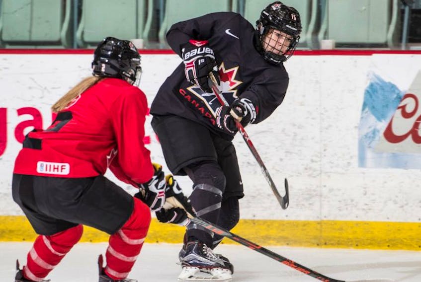 Maggie Connors (right) is shown in action earlier this month in Calgary during an instra-squad game that was part of the selection process for the Canadian women’s under-18 hockey team. The 16-year-old from St. John’s made the team, which will compete in a three-game series against the United States starting Thursday in Lake Placid, N.Y.