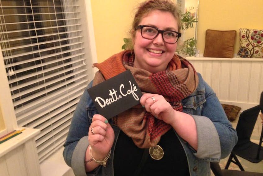 Jackie Hibbs said she loved the atmosphere of the Death Café and proudly displayed her personalized card.