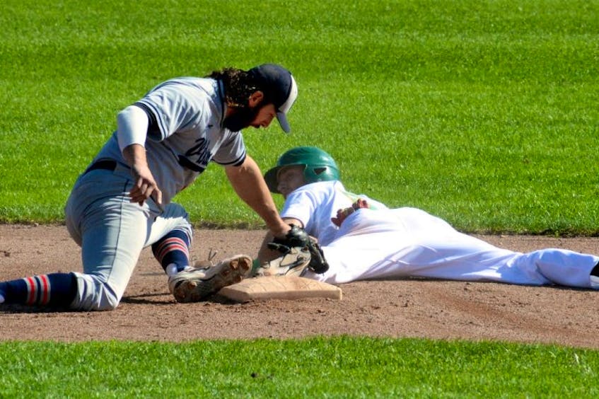 Trevor Clarke of Shamrocks is safe at second, keeping his toe on the bag as Gerald Butt of the Gonzaga Vikings applies the tag in Game 3 of the St. John’s Molson Senior Baseball League final Sunday at St. Pat’s Ball Park. Shamrocks won the game 5-2 for a 3-0 series lead.