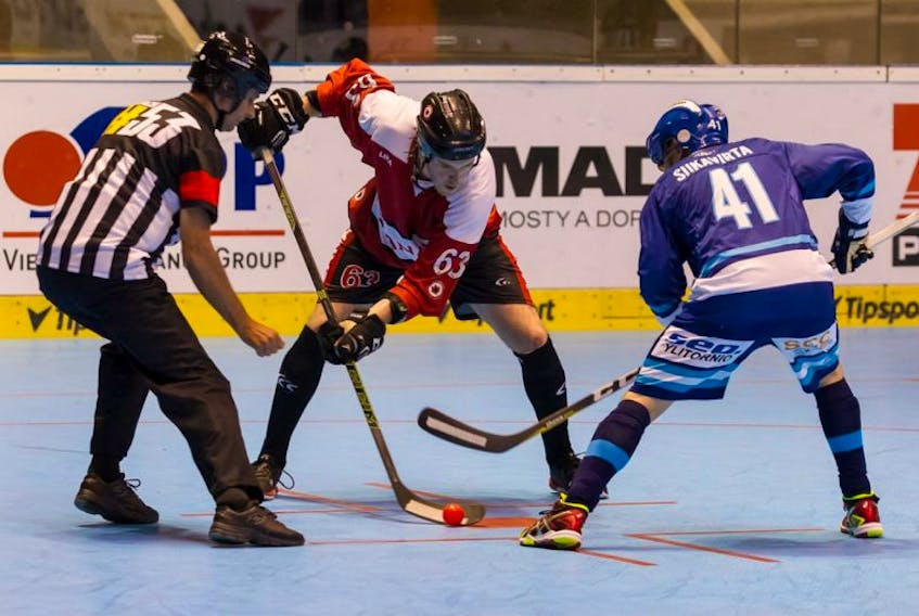 Team Canada’s Brad Yetman (63) wins a faceoff against Finnish captain Arto Siikavirta during their round-robin game at the world ball hockey championships in Pardubice, Czech Republic on Saturday. Yetman is one of seven players from Newfoundland on the Canadian men’s team roster

