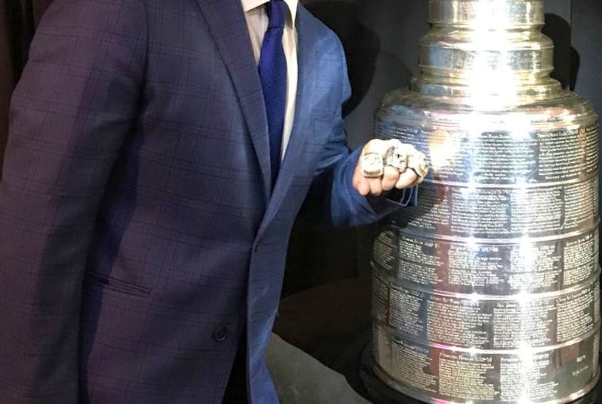 Derek Clancey of St. John's shows off the three Stanley Cup rings he's won as the Pittsburgh Penguins' director of pro scouting.