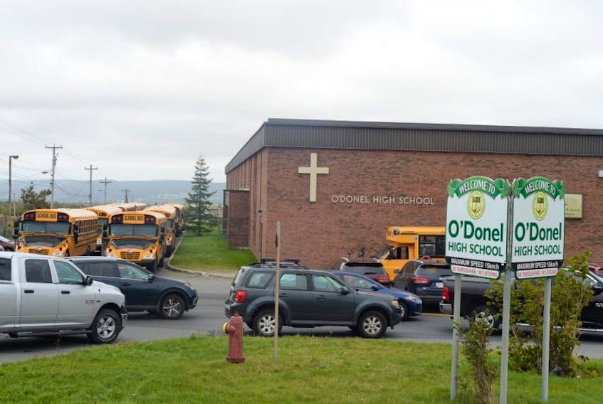 Parents, guardians and school bus operators wait outside O’Donel High School on Ruth Avenue in Mount Pearl Thursday afternoon while the school was still in lockdown mode. The lockdown was lifted near 2:45 p.m. and students then were allowed to leave school for the day.