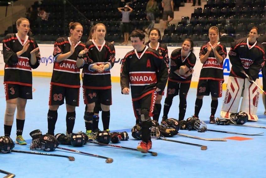 Her Canadian teammates, including fellow players from Newfoundland and Labrador (from left) Chloe Tinkler (3) of Wabush, Amanda Kean (93) of St. Anthony and Dawn Tulk (14) of Port Saunders, applaud as assistant captain Kristen Cooze (7) of Kippens is announced as Canada’s player of the game after a 2-1 win over Slovakia Tuesday at the International Street and Ball Hockey Federation’s 2017 world women’s championship in Pardubice, Czech Republic. 
