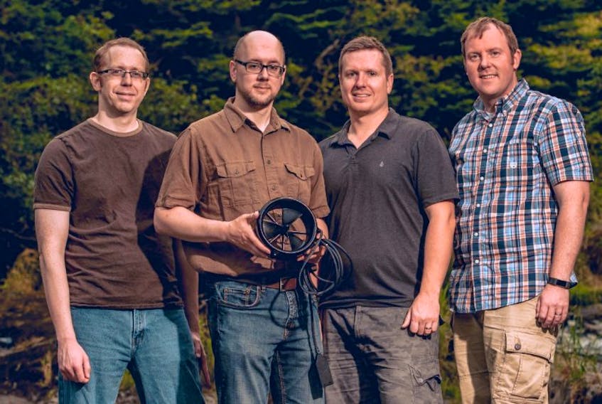Founders of Seaformatics Systems Inc. (from left) Robert Boyd, Geoff Holden, Adam Press and Andrew Cook have briefly stepped away from designing and manufacturing power harvesting and wireless communication technology for the subsea market to develop and launch a smaller version of their hydroelectric turbine technology for the everyday consumer.