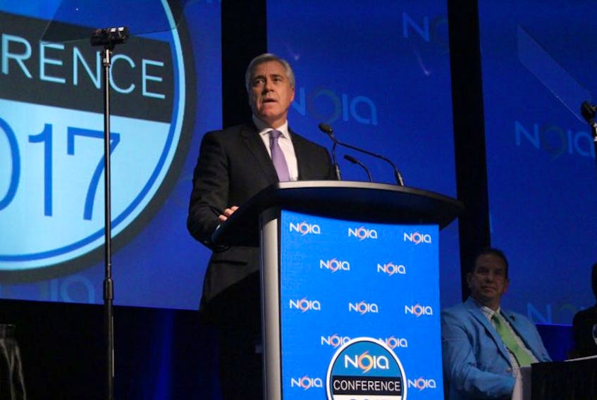 Premier Dwight Ball addresses delegates at the NOIA oil and gas industry conference Tuesday. Ball offered his condolences for the two workers killed this week working on the new Bay d’Espoir transmission line.
