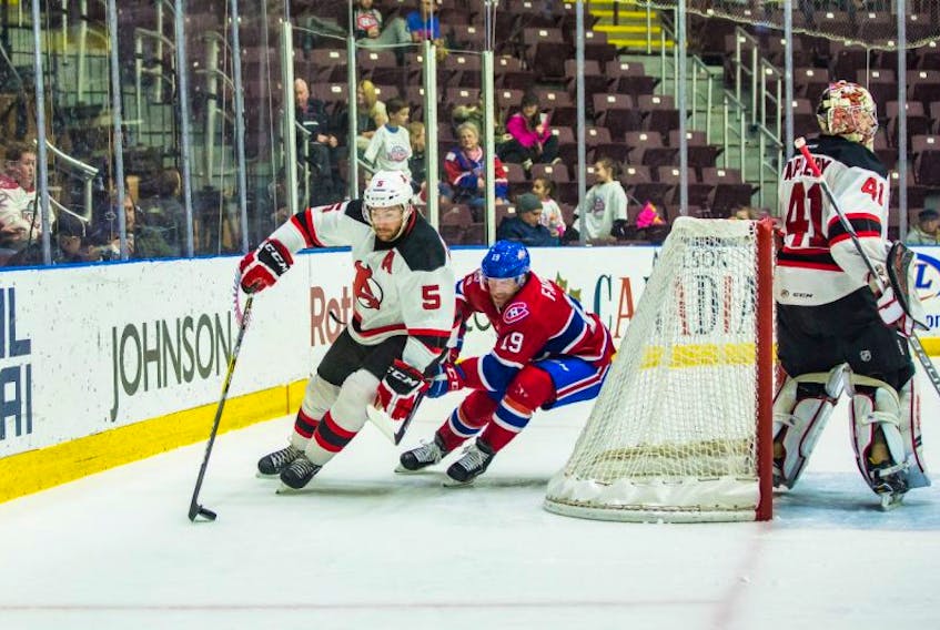 St. John’s IceCaps forward (19), shown in action against Andrew MacWilliam (5) and the Albany Devils at Mile One Centre earlier this season, knows both sides of the challenge that is the IceCaps’ home schedule