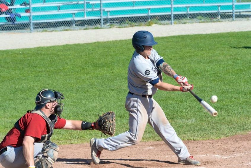 In this file photo, Mike O'Neil of the Gonzaga Vikings connects for a base hit as Holy Cross Crusaders catcher Mark Healy looks during a St. John’s senior baseball playoff game St. Pat's Ball Park. O’Neil and the Vikings club team, augmented by some added-on players, are representing Newfoundland and Labrador at Baseball Canada’s national senior men’s championship, starting today in Victoria, B.C.
