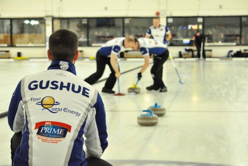 Skip Brad Gushue watches as Mark Nichols (left) and Brett Gallant (right) sweep a rock thrown by Geoff Walker during round-robin play in the 2016 Tankard provincial men’s curling championship at the Re/Max Centre in St. John’s. Gushue will be after an 11th straight provincial title when play begins in the 2017 Tankard