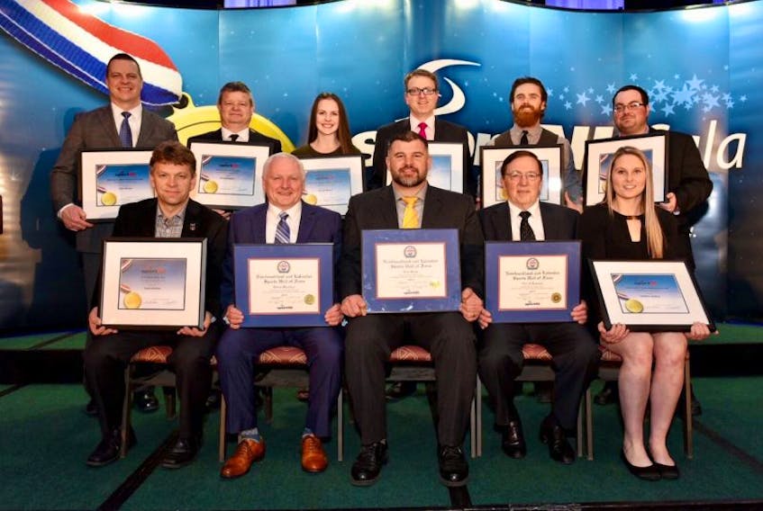 Sport Newfoundland and Labrador revealed its annual provincial award winners for 2016 and inducted three new members into its Hall of Fame during a banquet Saturday night at the Sheraton Hotel in St. John’s. Among those recognized and honoured were (from left) Harold Walters, representing the Brad Gushue curling rink (team of the year), Hall of Fame inductees Glenn Stanford, Rod Snow and Gerald Lomond and baseball player Heather Healey (senior female athlete of the year); back row: Todd Hickey, representing para-athlete Liam Hickey (junior male athlete of the year), soccer’s Shayne Dunphy (volunteer of the year), track and field athlete Camryn Bonia (junior female athlete of the year), rugby’s John Cowan (executive of the year), wrestling’s Noel Strapp (coach of the year) and baseball’s Ryan Garland (official of the year).