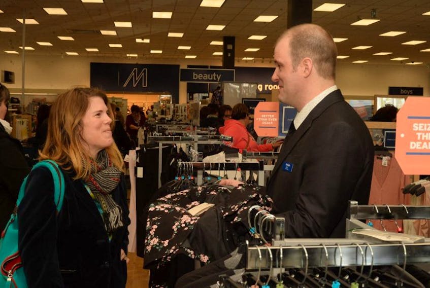 Among the afternoon shoppers to visit the store was Emily Deming, seen here chatting with store manager Dan Lasby as he made his rounds in the store greeting customers. 