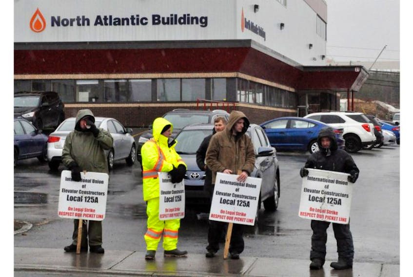 Members of the International Union of Elevator Constructors Local 125A picketed outside the office of North Atlantic on Monday after learning about replacement workers scheduled to complete a job inside. The union has been on strike for close to six months and blames the Construction Labour Relations Association for delaying the signing of a new collective bargaining agreement.